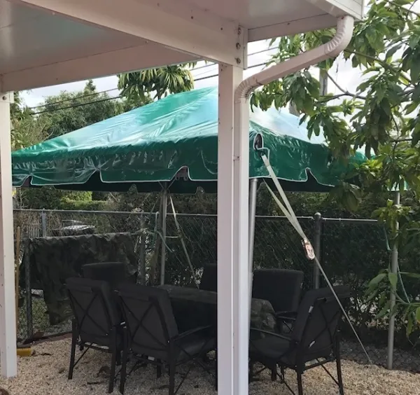 Outdoor dining setup with green tent