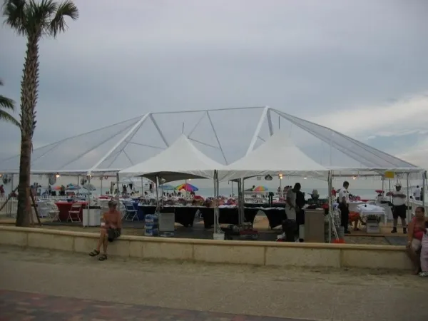Seaside vendor area with people browsing