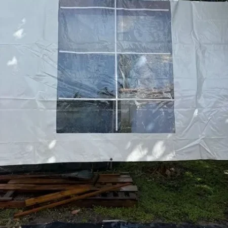Clear plastic sheet against tree background