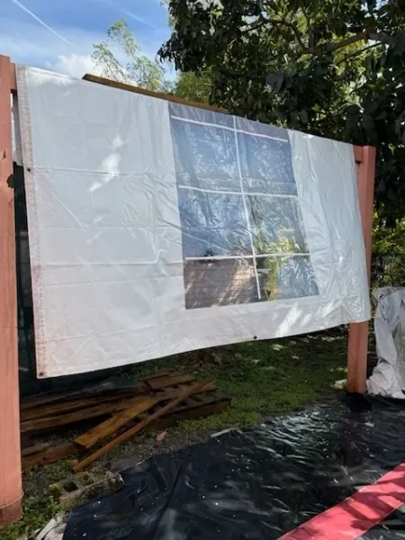Outdoor screen setup with white covering