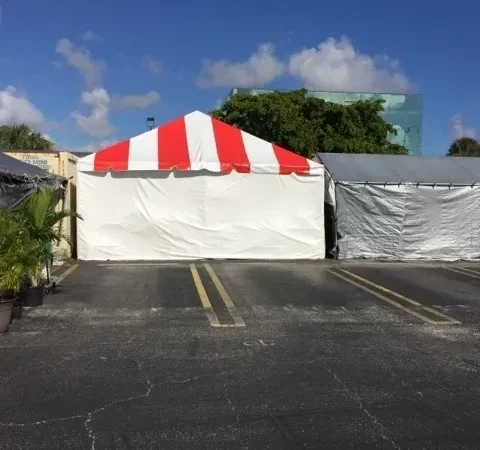 Small tent set up in empty parking area.